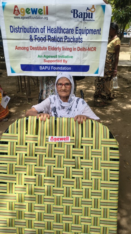 Asiya Begam, an older woman supported through the Agewell and BAPU Foundation partnership, with a folding bed provided through the programme